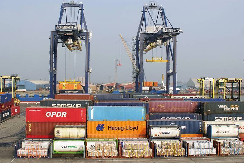 colourful container boxes with 2 gantry cranes in the background