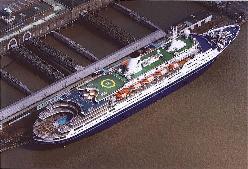 a Navy blue cruise ship at London Cruise Terminal