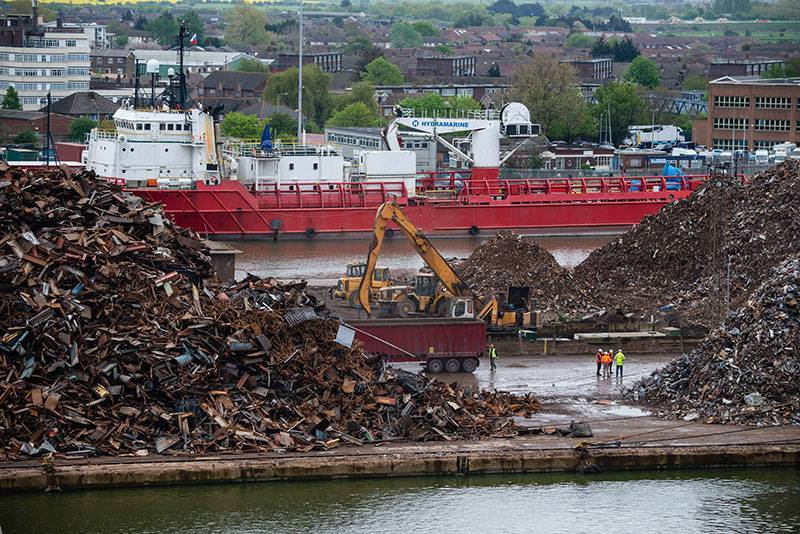A digger working at scrap yard