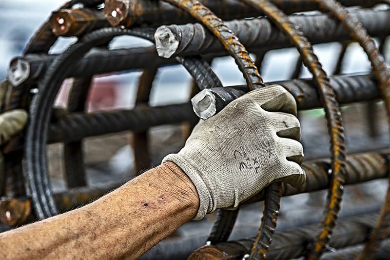 Gloved hand on metal