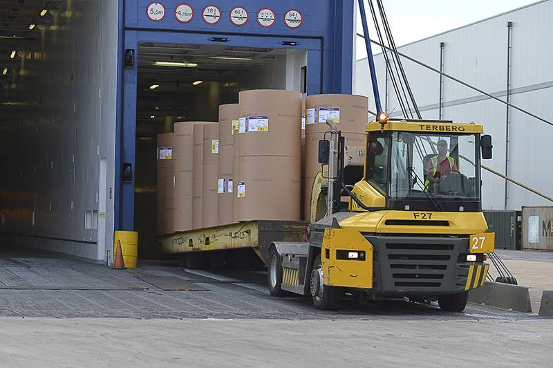 Yellow tug discharging paper cassette from RoRo ferry