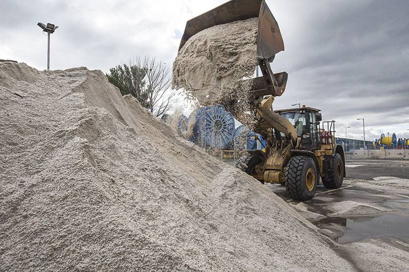 a shovel driver moving road salt